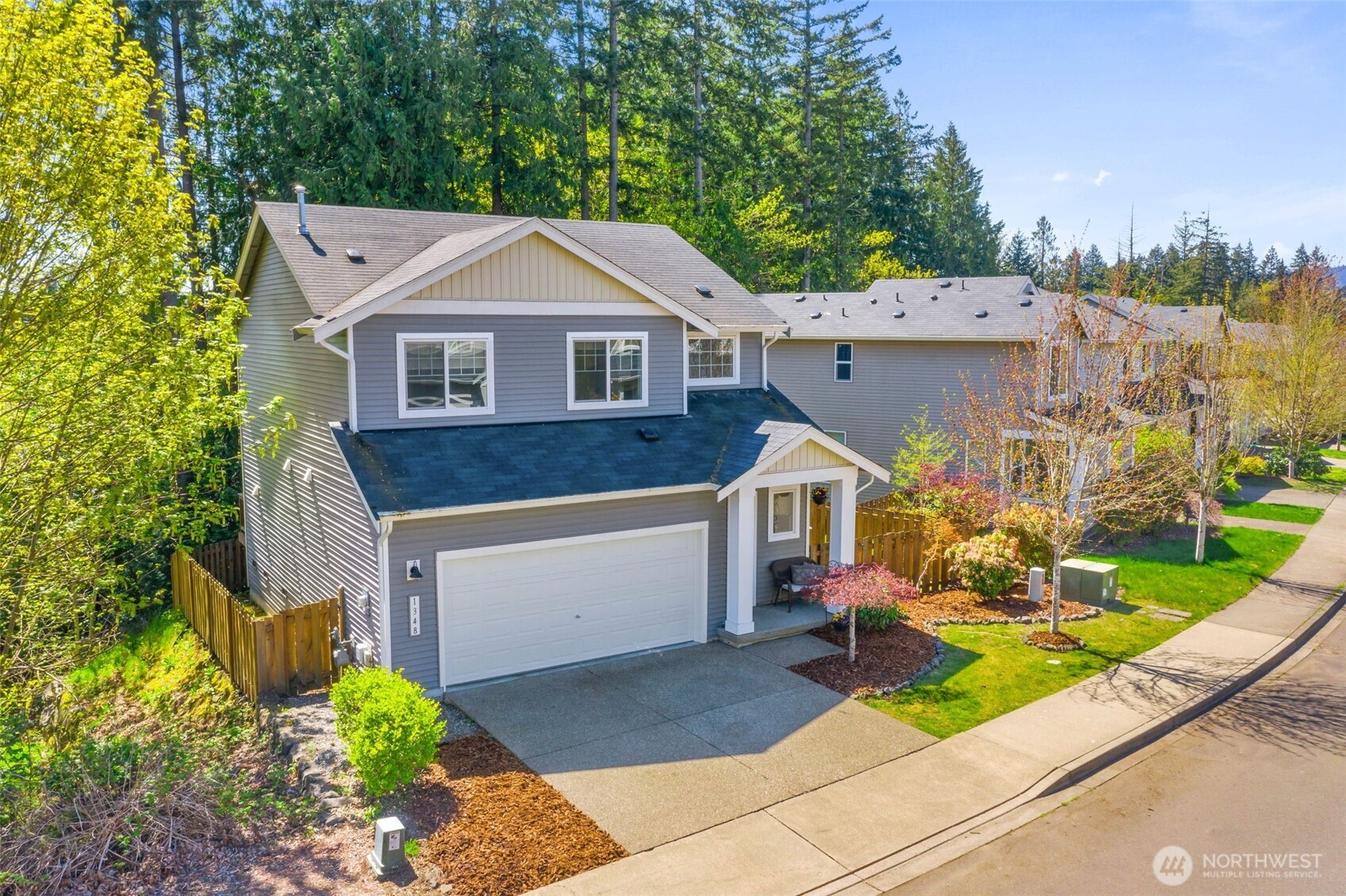 1348 Ebbets Drive Tumwater, WA 98512 - Photo 3 of 37 a front view of a house with a yard