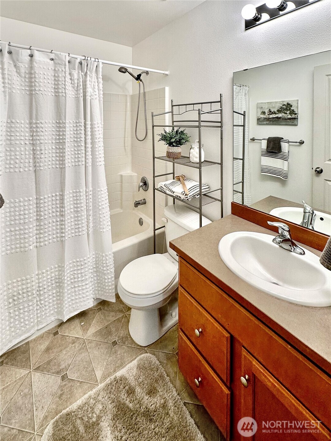 1348 Ebbets Drive Tumwater, WA 98512 - Photo 32 of 37 a bathroom with a sink toilet and shower