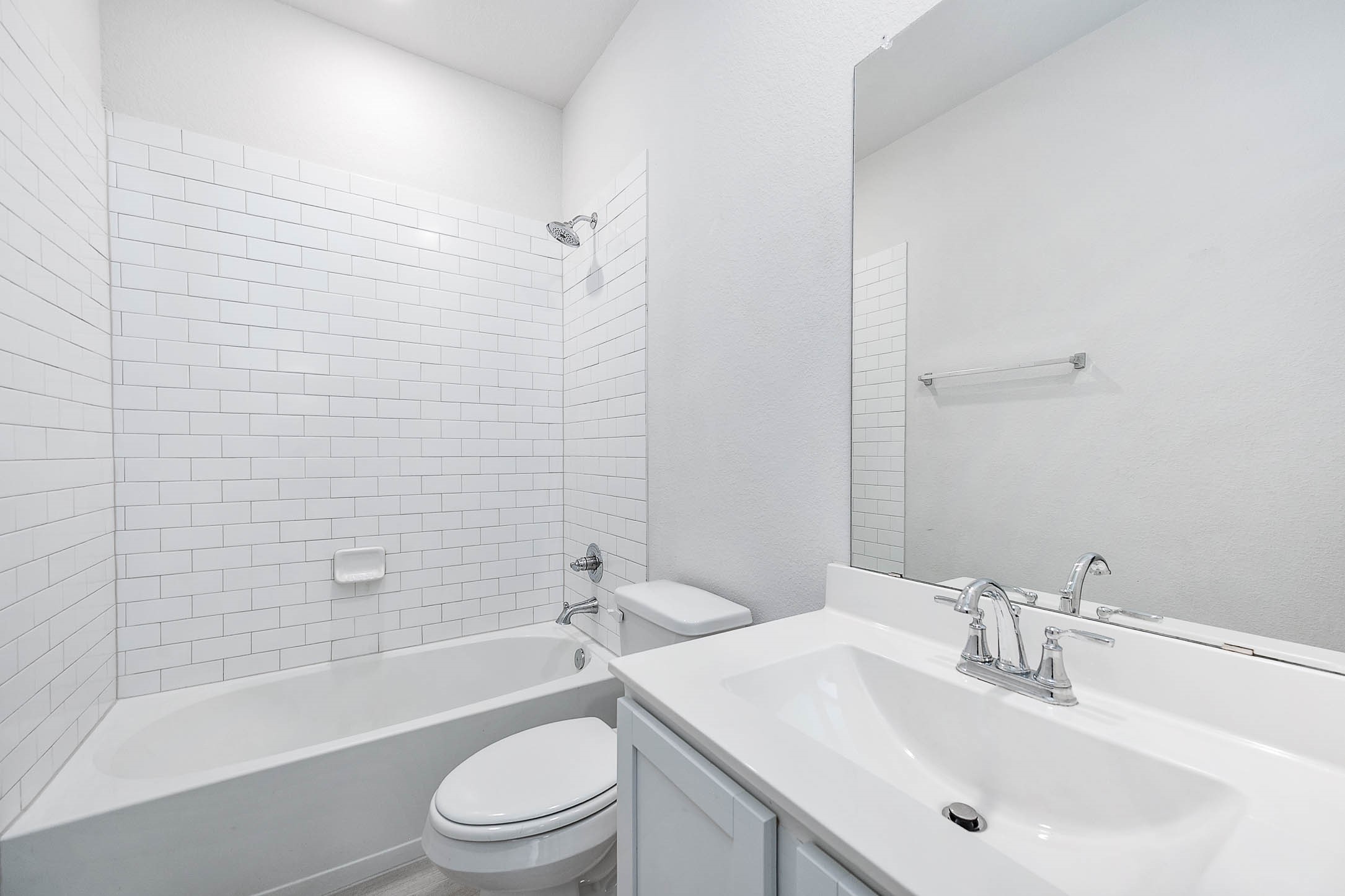 3611 Prairie Rose Trail Angleton, TX 77515 - Photo 16 of 25 a bathroom with a sink a toilet and shower