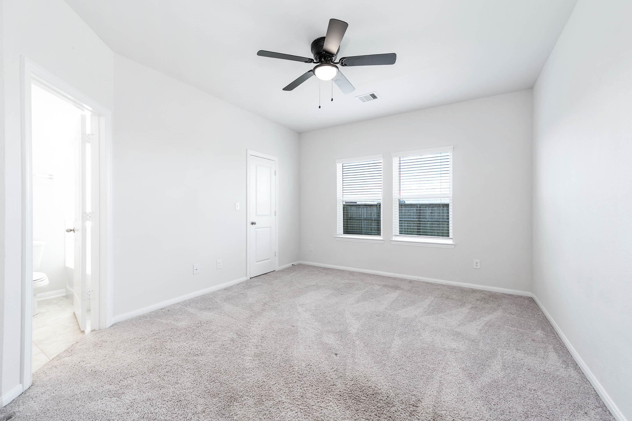 3611 Prairie Rose Trail Angleton, TX 77515 - Photo 18 of 25 a view of an empty room with a window