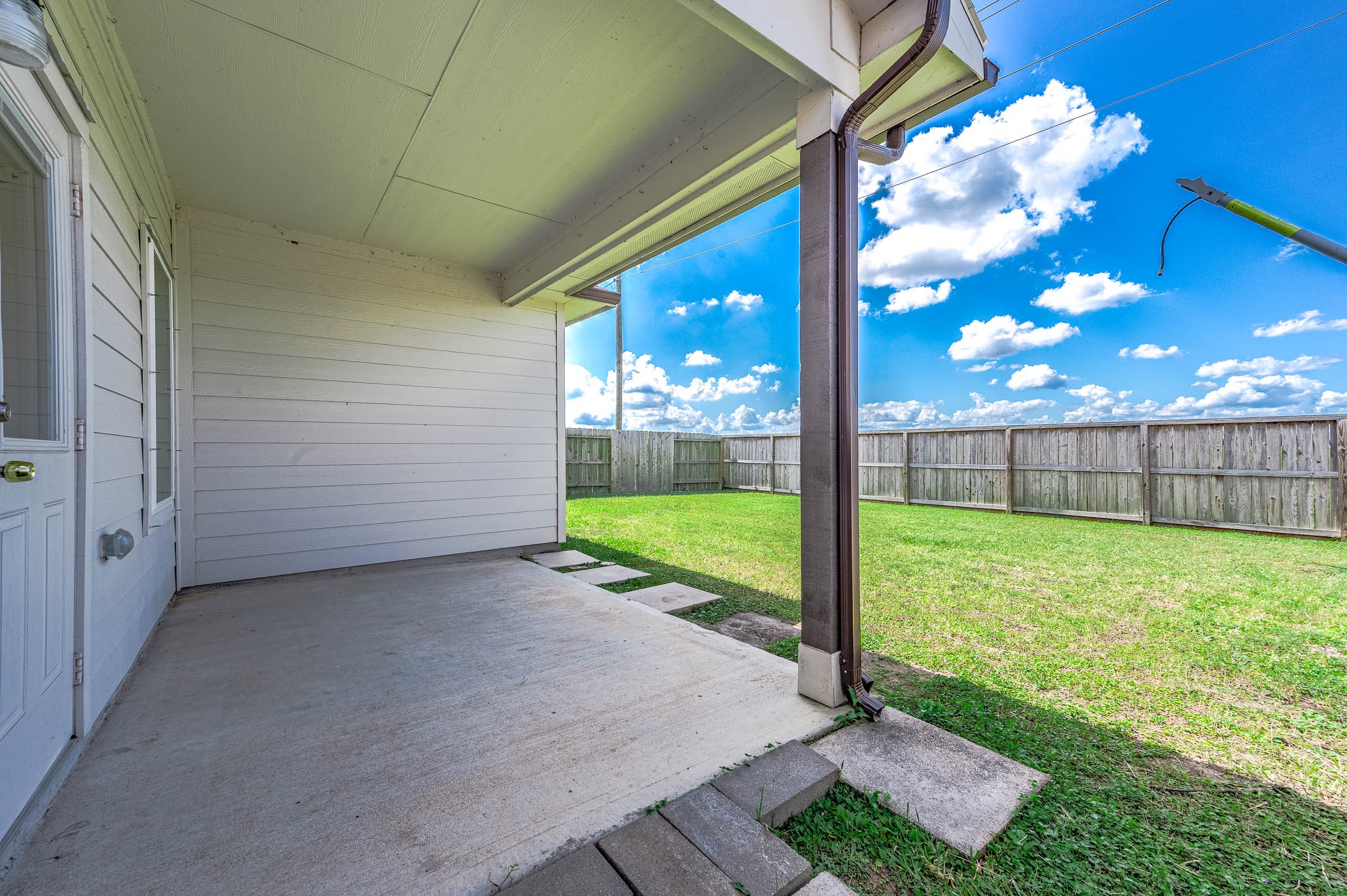 3611 Prairie Rose Trail Angleton, TX 77515 - Photo 22 of 25 a view of a porch with a backyard