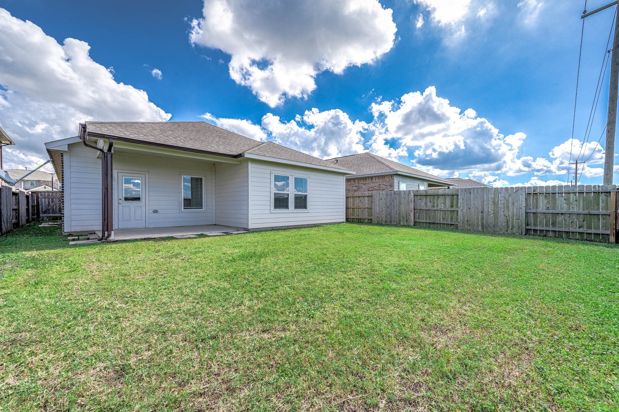 3611 Prairie Rose Trail Angleton, TX 77515 - Photo 23 of 25 a view of a house with a back yard