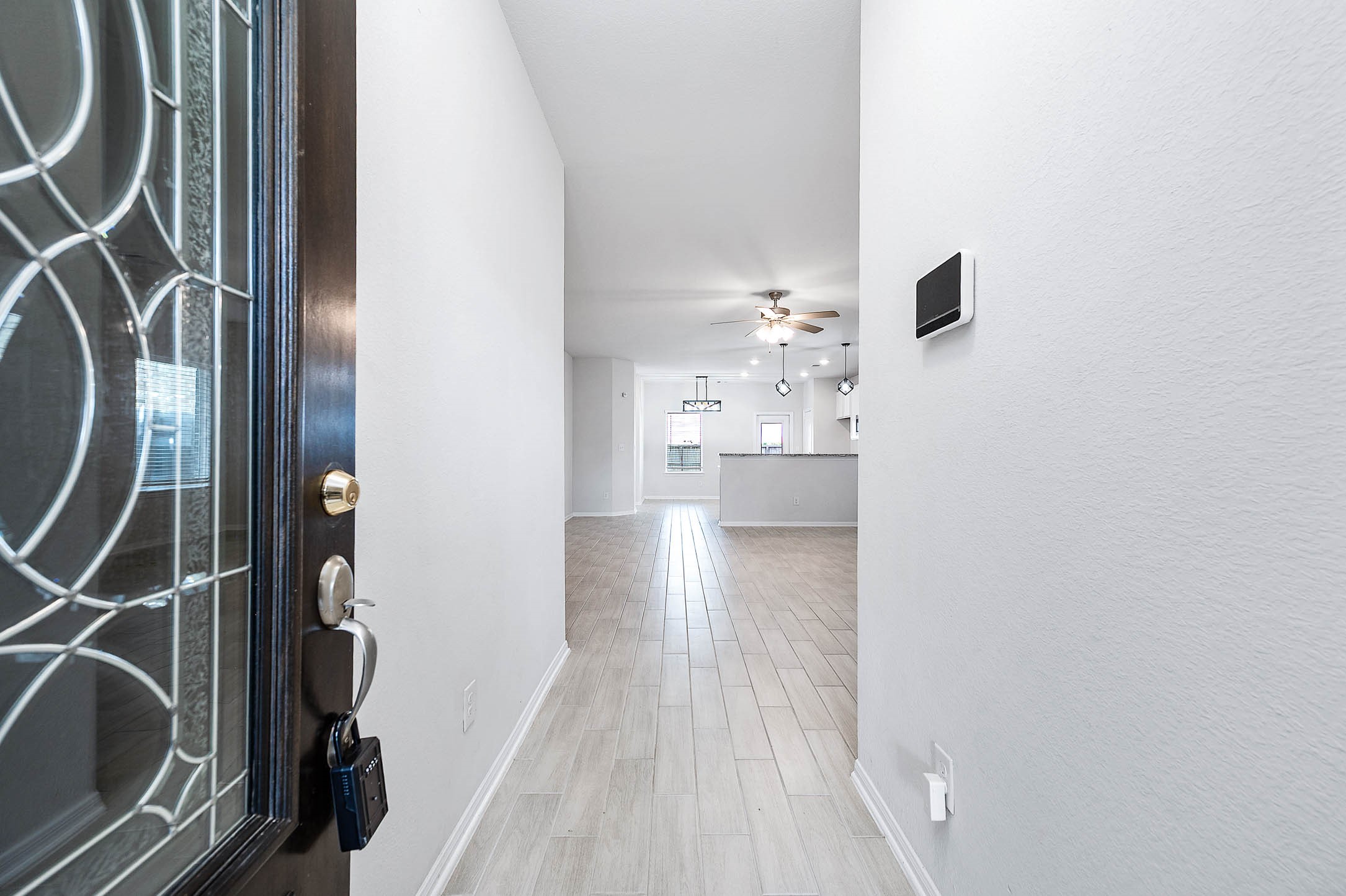 3611 Prairie Rose Trail Angleton, TX 77515 - Photo 4 of 25 a view of a kitchen from the hallway