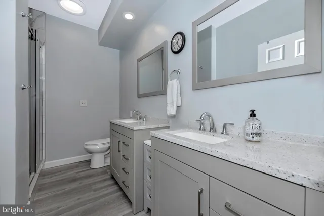 a bathroom with a shower and a sink