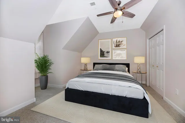 a view of a small space with wooden fence