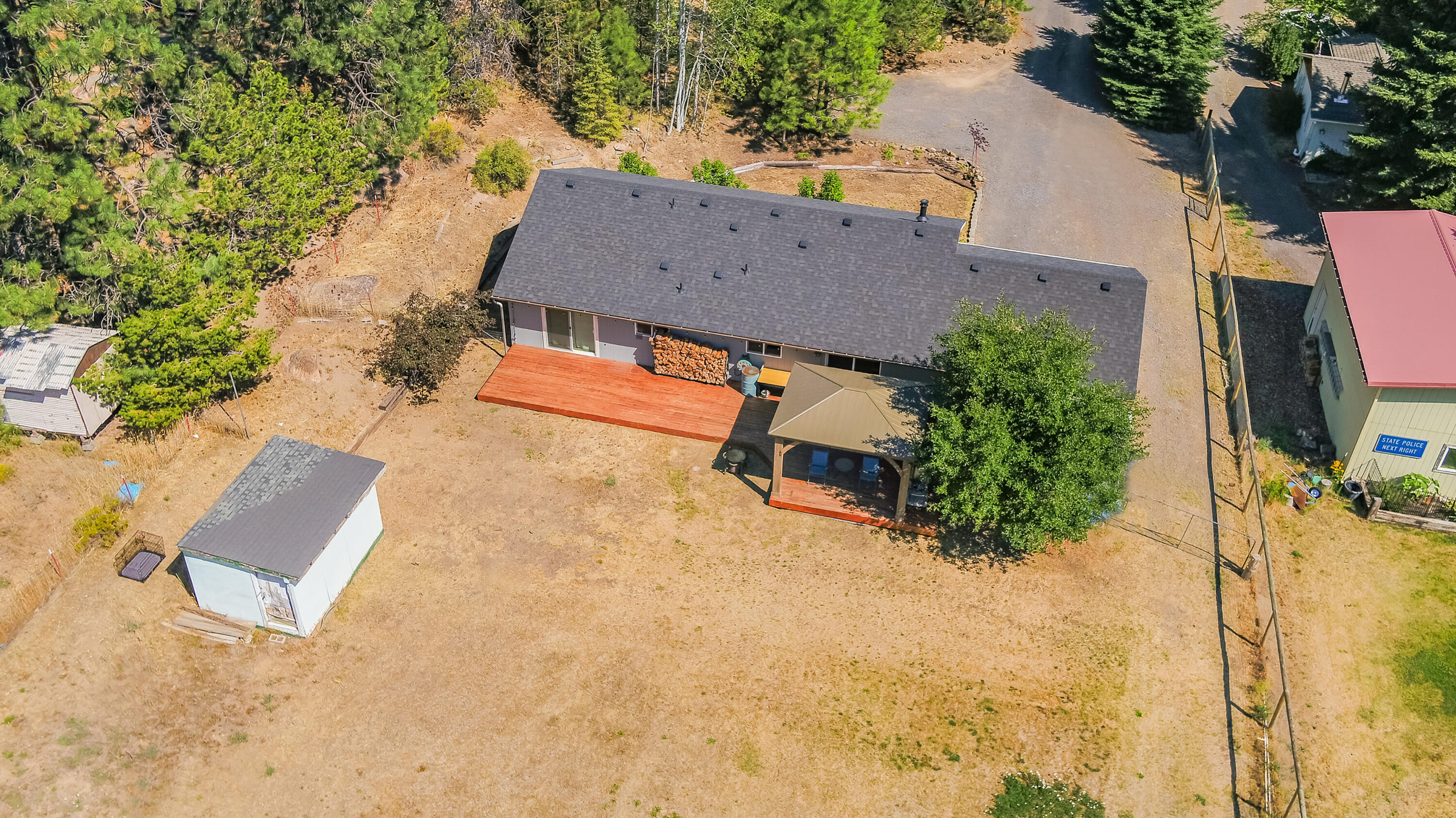 19149 Pumice Butte Road Bend, OR 97702 - Photo 15 of 20 driveway extends to the side of the house with access to the back