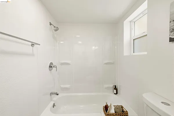 a bathroom with a toilet a sink and a bathtub