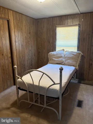 a view of a dining room with furniture and window