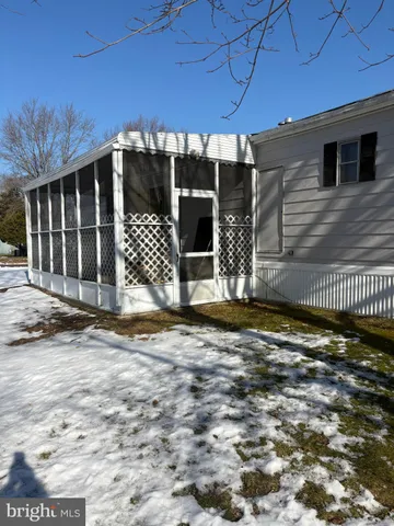 a view of a house with a street