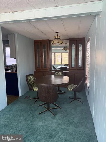 a living room with furniture a window and a table