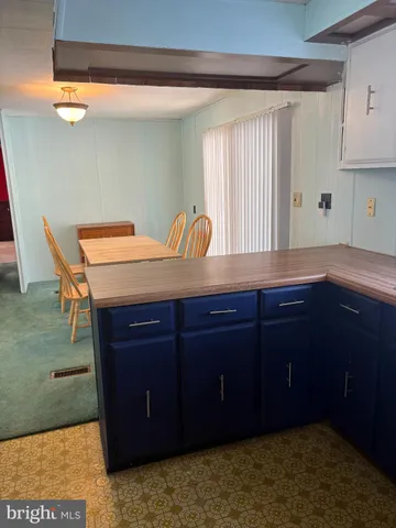 a kitchen with a cabinets and window