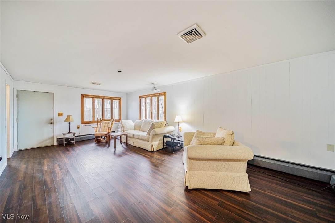 2510 Rockefeller Road Wickliffe, OH 44092 - Photo 23 of 33 Living room with baseboard heating and dark wood-type flooring