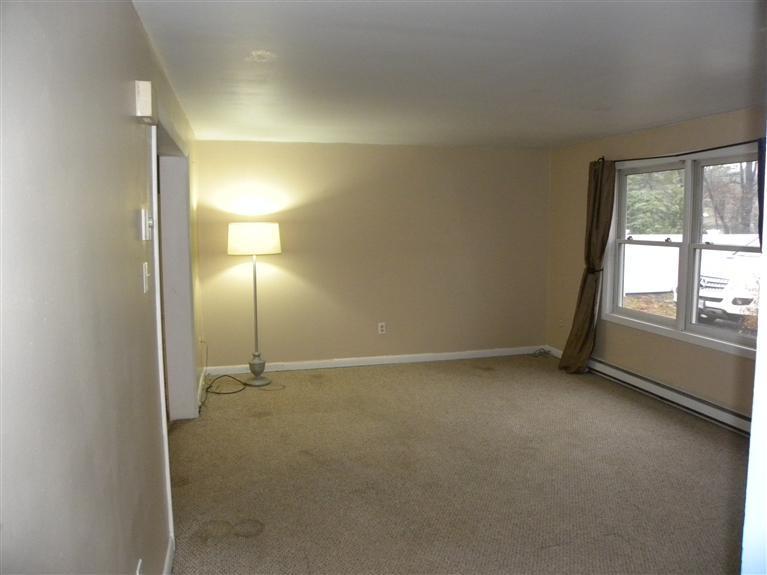 33 Uncle Edwards Road Mashpee, MA 02649 - Photo 3 of 5 an empty room with a empty space and windows