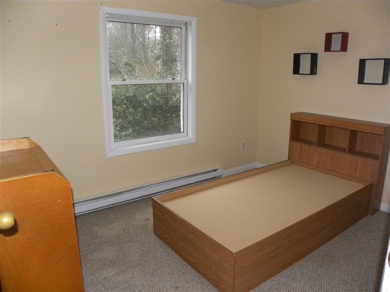 33 Uncle Edwards Road Mashpee, MA 02649 - Photo 4 of 5 a view of an empty room with a window