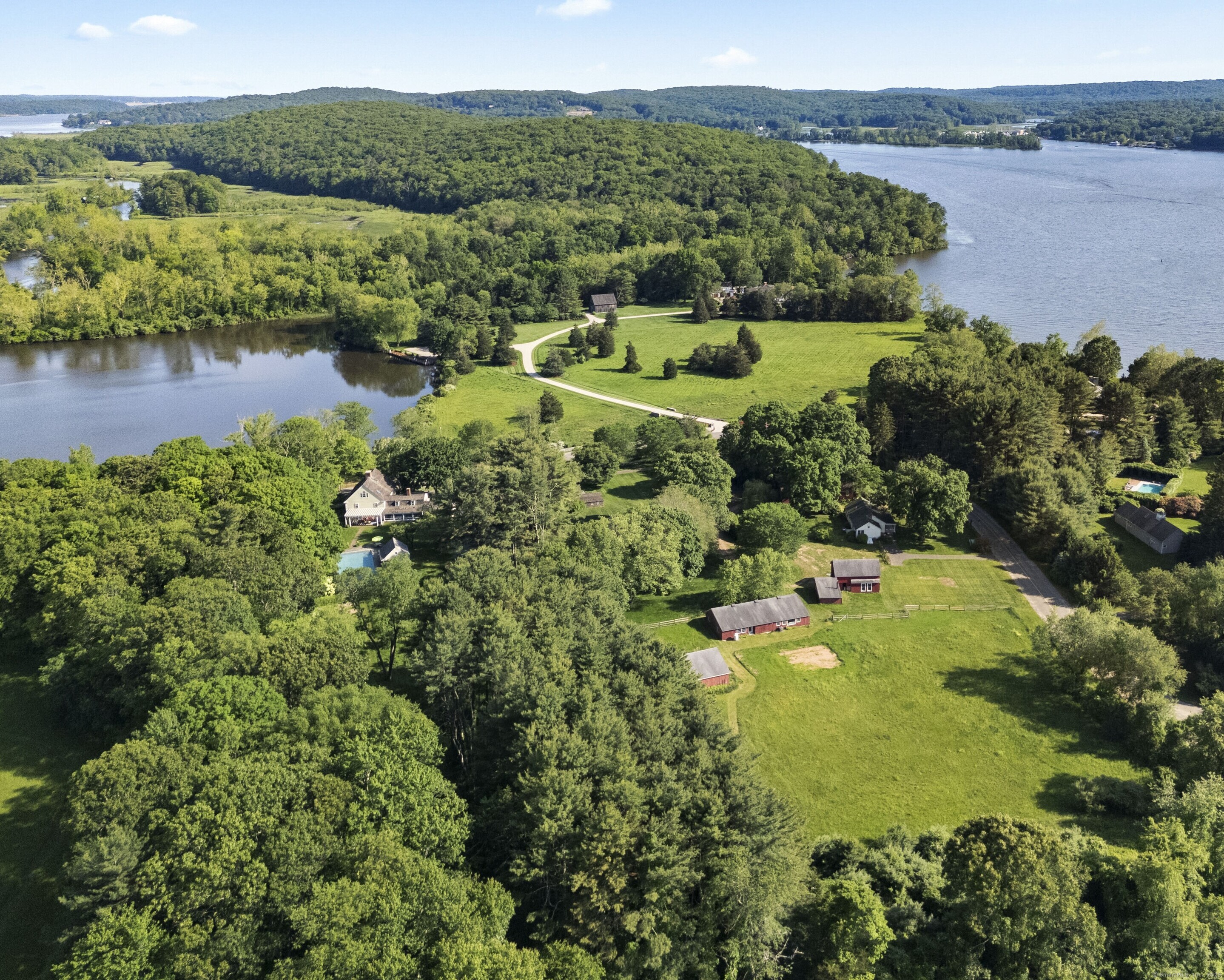 an aerial view of a houses with a lake view