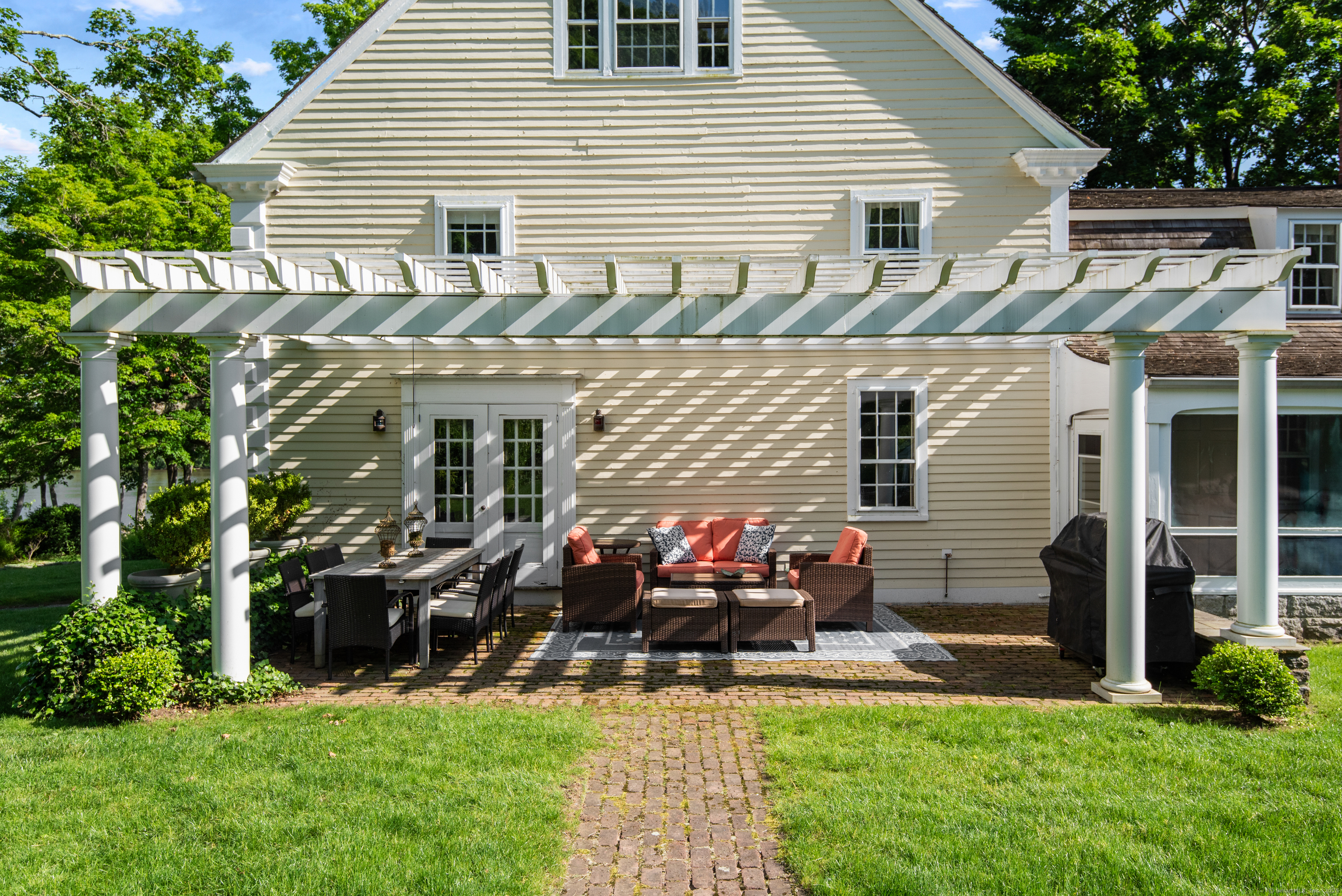 53-1 Selden Road Lyme, CT 06371 - Photo 25 of 40 Outdoor patio seating under a large pergola with access from the library.