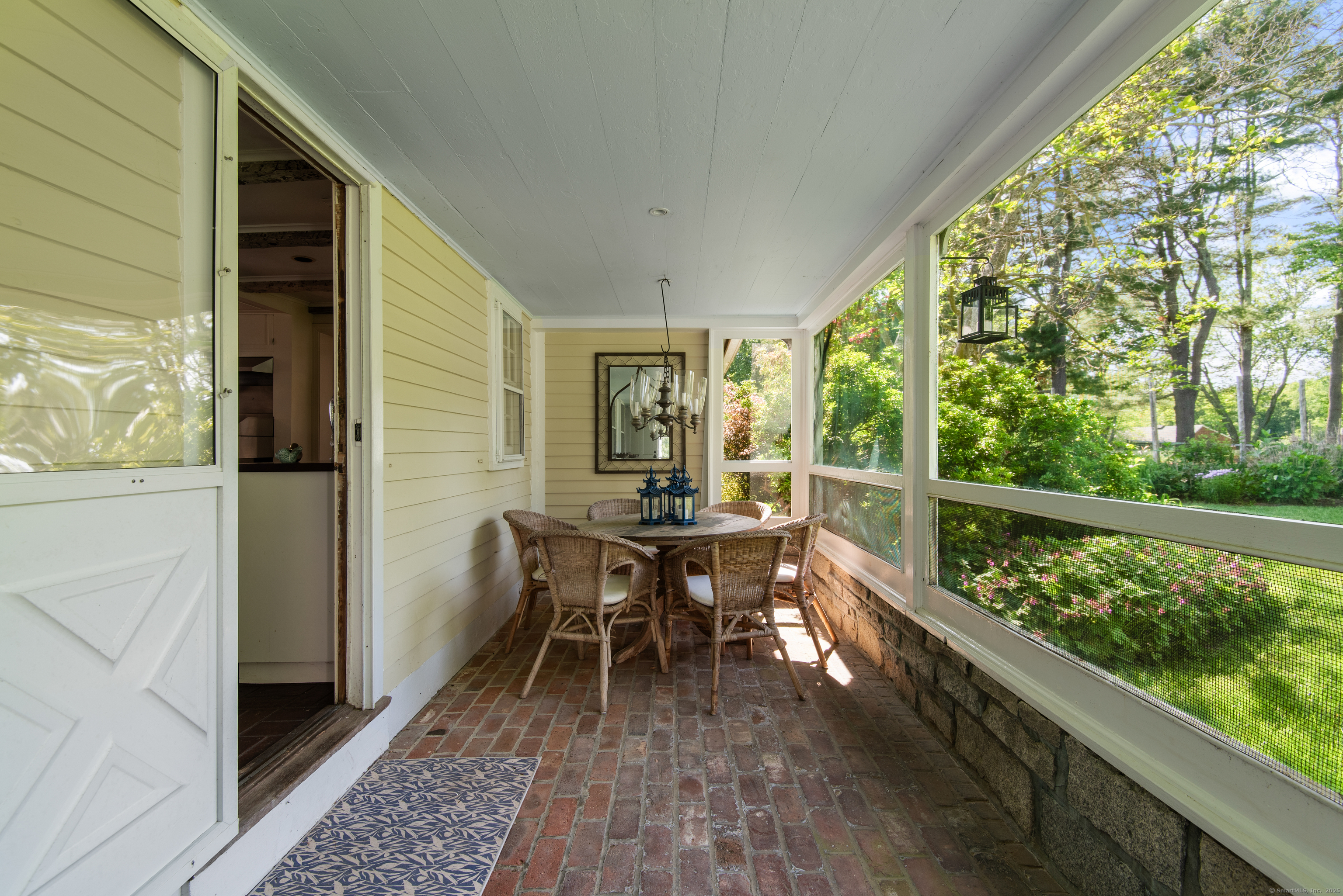 53-1 Selden Road Lyme, CT 06371 - Photo 8 of 40 Casual dining area in the screened porch with access from the dining room and kitchen.