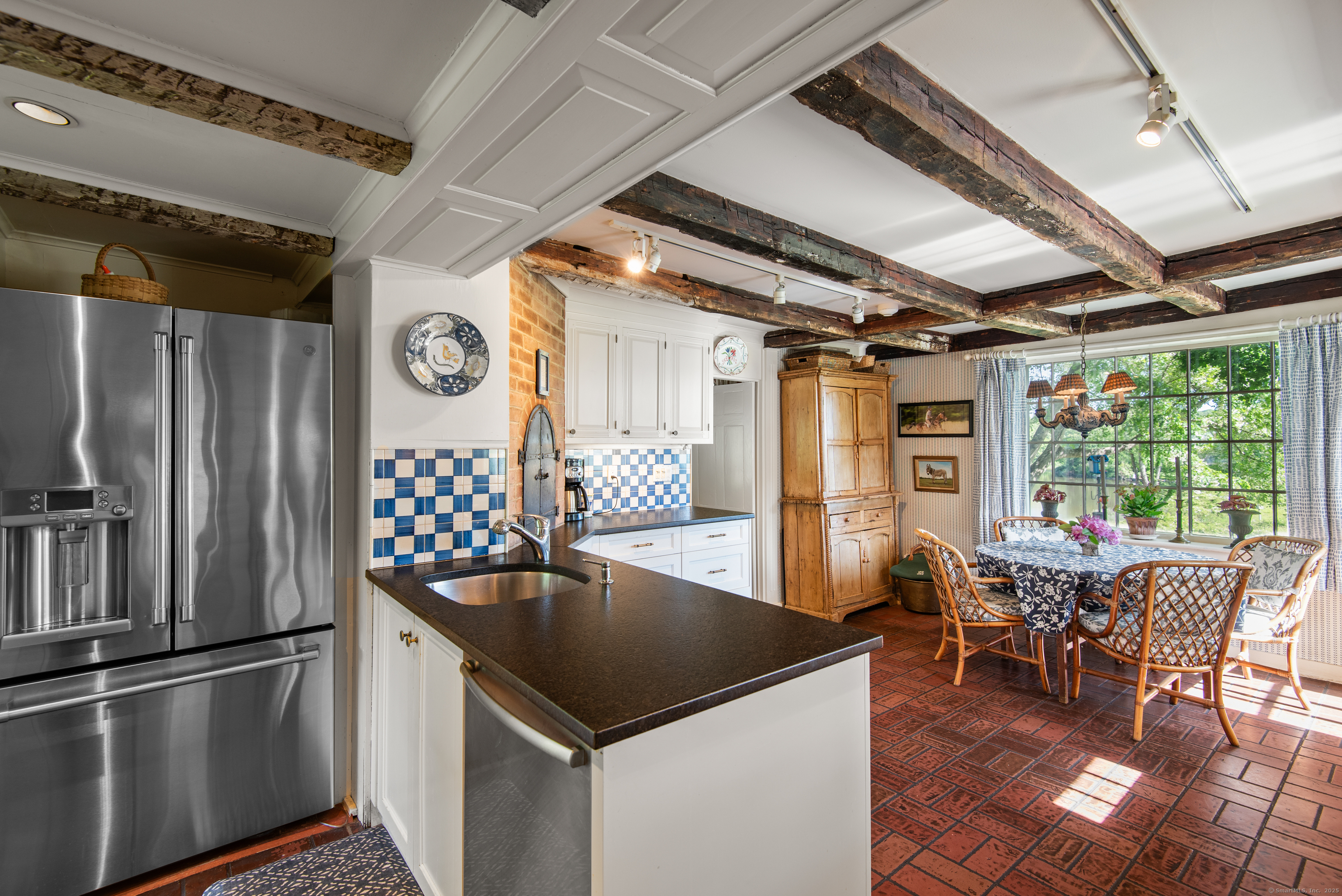 53-1 Selden Road Lyme, CT 06371 - Photo 9 of 40 Versatile kitchen with plenty of counter space, a casual dining area and small hearth fireplace.