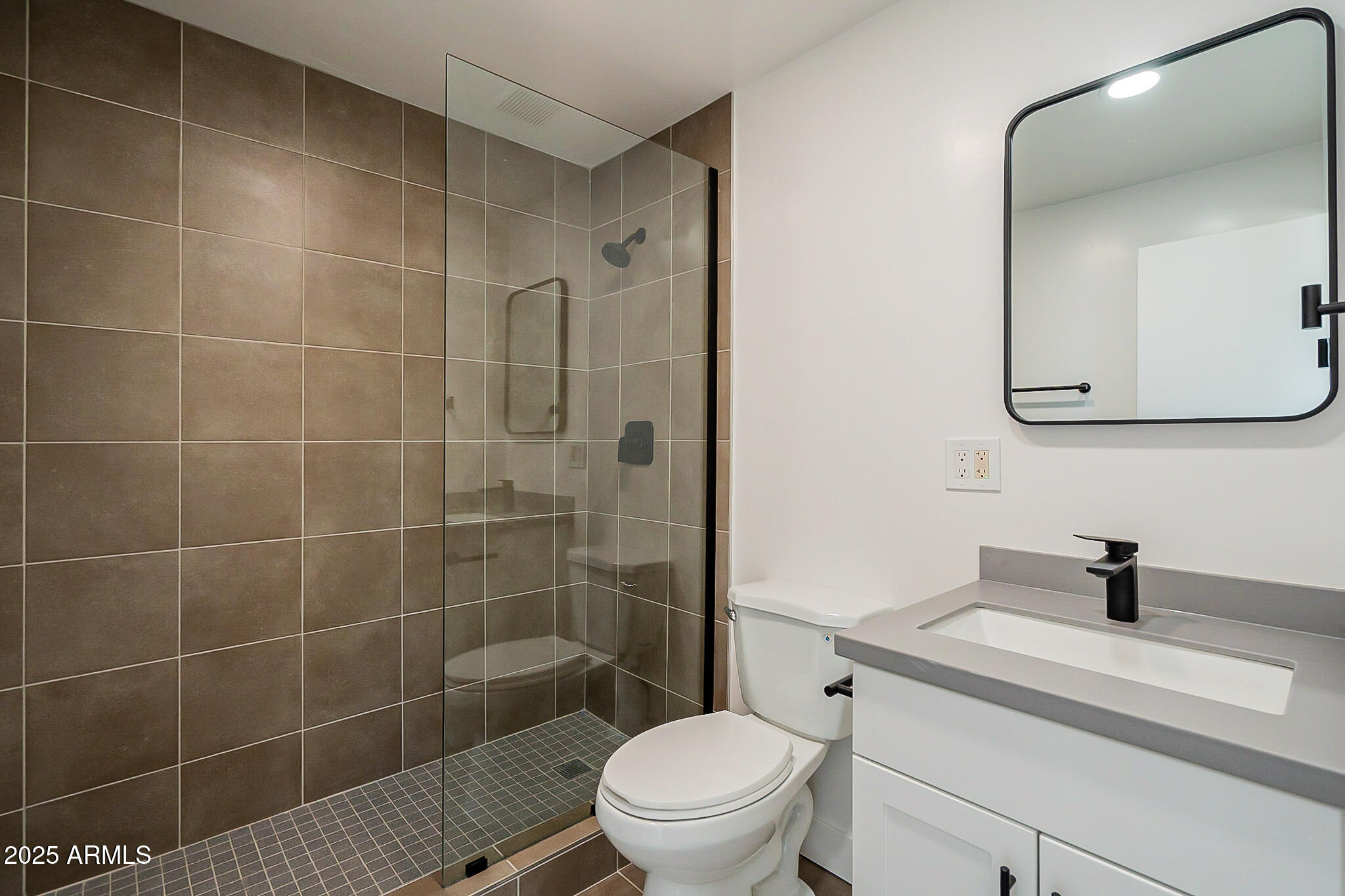 1316 East Lemon Street Tempe, AZ 85281 - Photo 22 of 43 a bathroom with a sink a toilet and shower