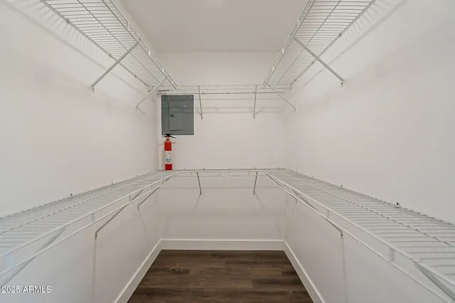 a view of a storage & utility room with racks on the wall