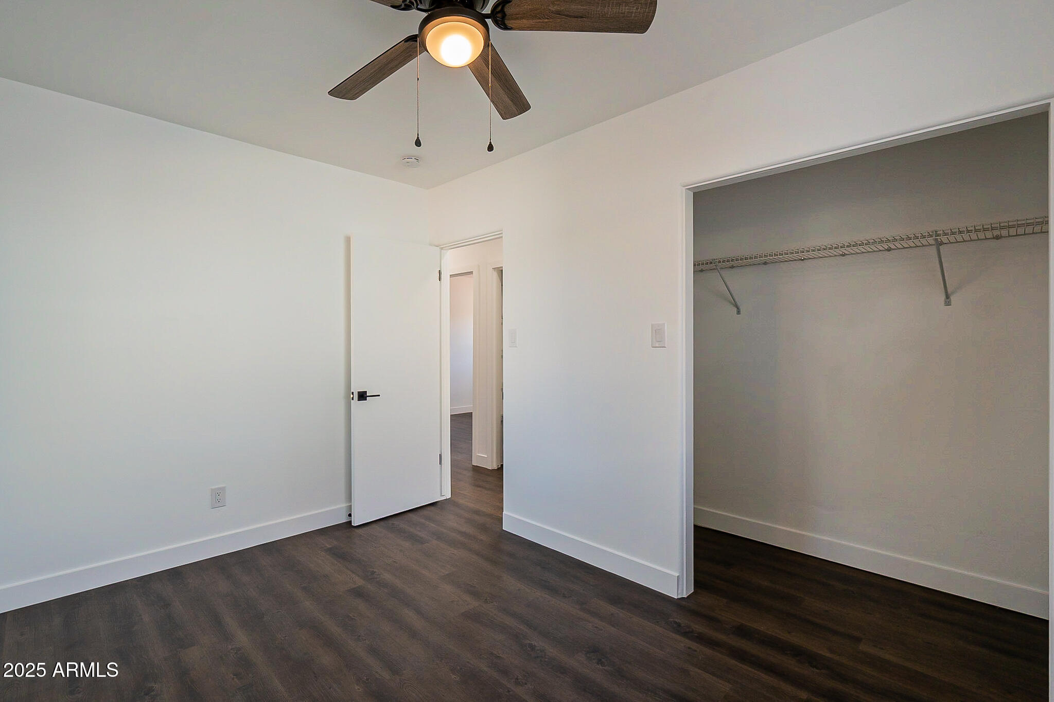 1316 East Lemon Street Tempe, AZ 85281 - Photo 28 of 43 a view of an empty room with wooden floor