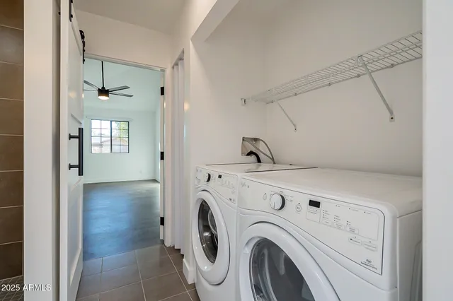 a view of a hallway with washer and dryer