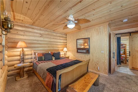 a bedroom with a bed and a walk in closet