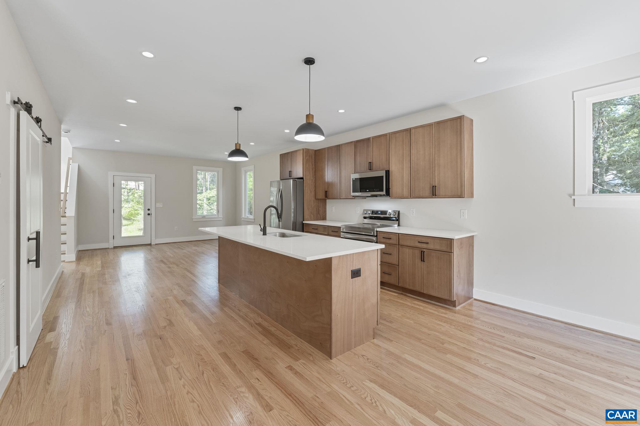 34 Turkeysag Trail Palmyra, VA 22963 - Photo 12 of 53 a large kitchen with stainless steel appliances granite countertop a stove a sink dishwasher and a oven with wooden floor