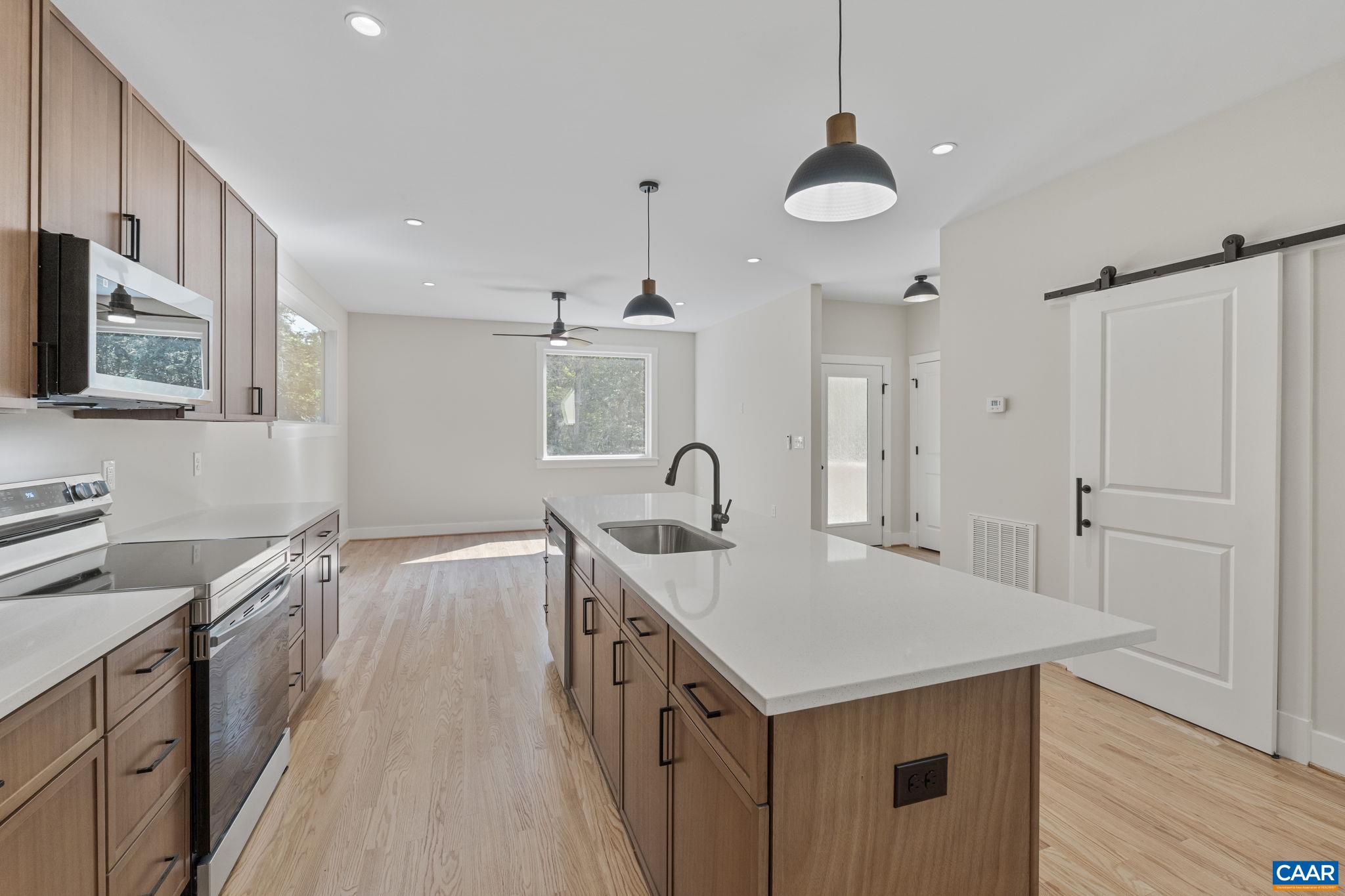34 Turkeysag Trail Palmyra, VA 22963 - Photo 14 of 53 a kitchen with a sink refrigerator and cabinets