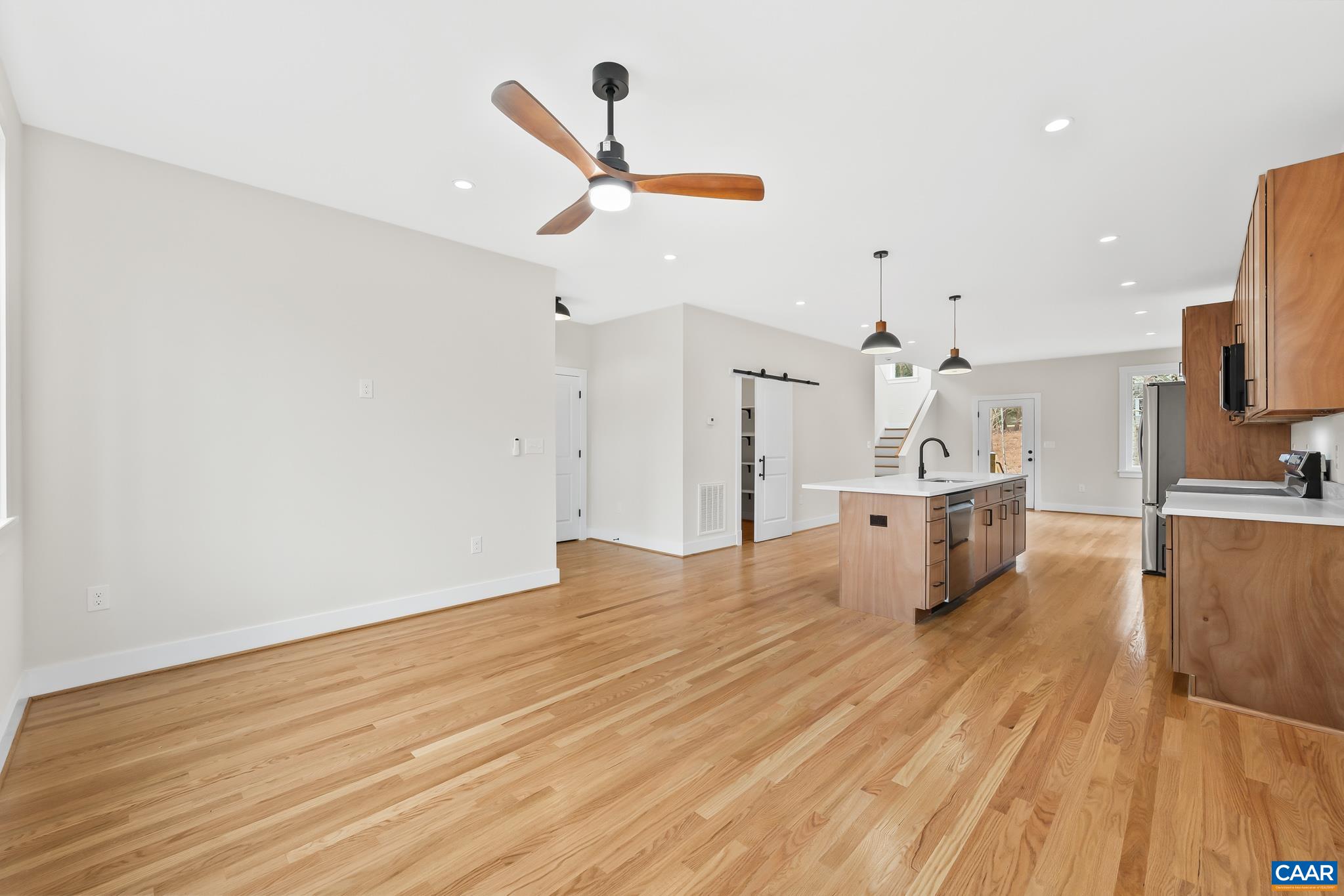 34 Turkeysag Trail Palmyra, VA 22963 - Photo 23 of 53 a view of kitchen and empty room with wooden floor