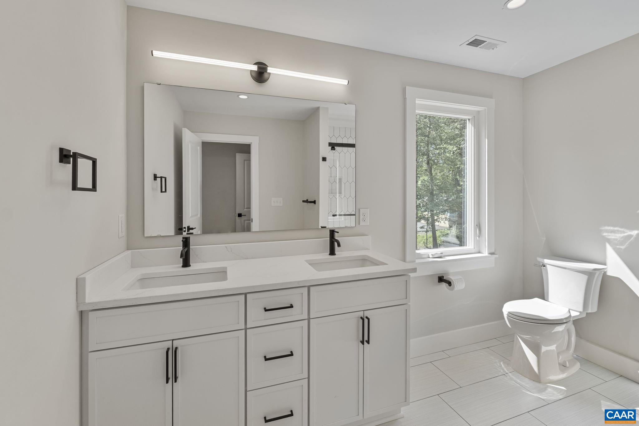 34 Turkeysag Trail Palmyra, VA 22963 - Photo 29 of 53 a bathroom with a toilet sink and mirror