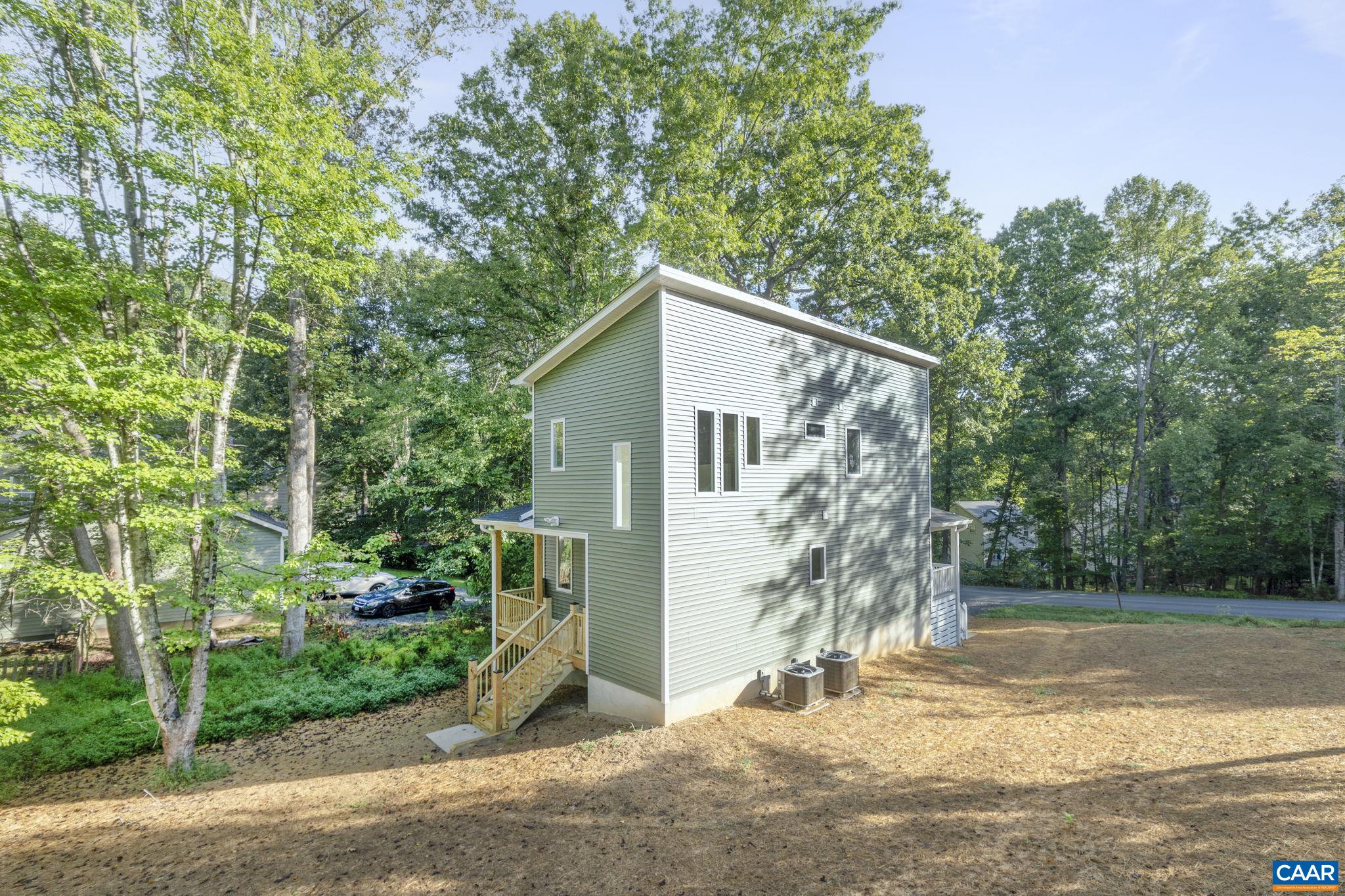 34 Turkeysag Trail Palmyra, VA 22963 - Photo 3 of 53 a view of a house with brick walls plants and large tree