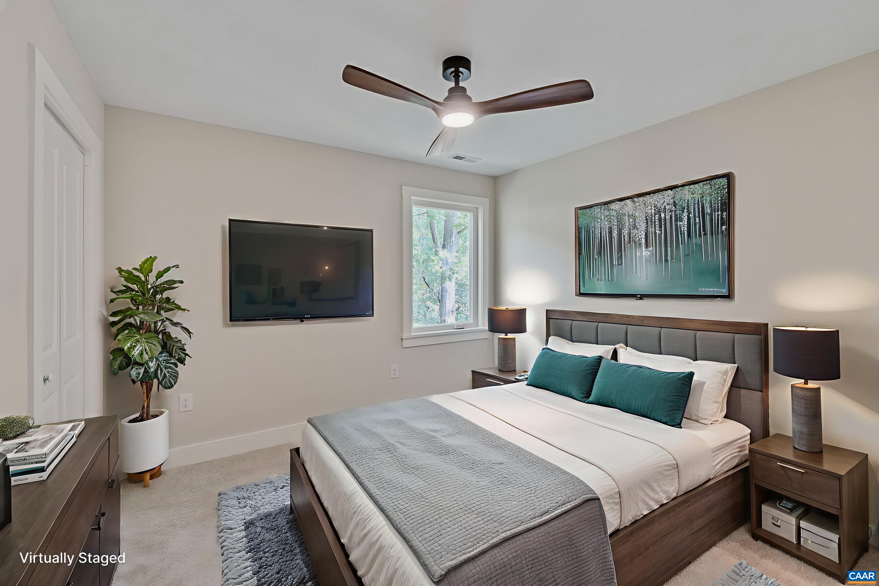 34 Turkeysag Trail Palmyra, VA 22963 - Photo 36 of 53 a bedroom with a bed and a potted plant