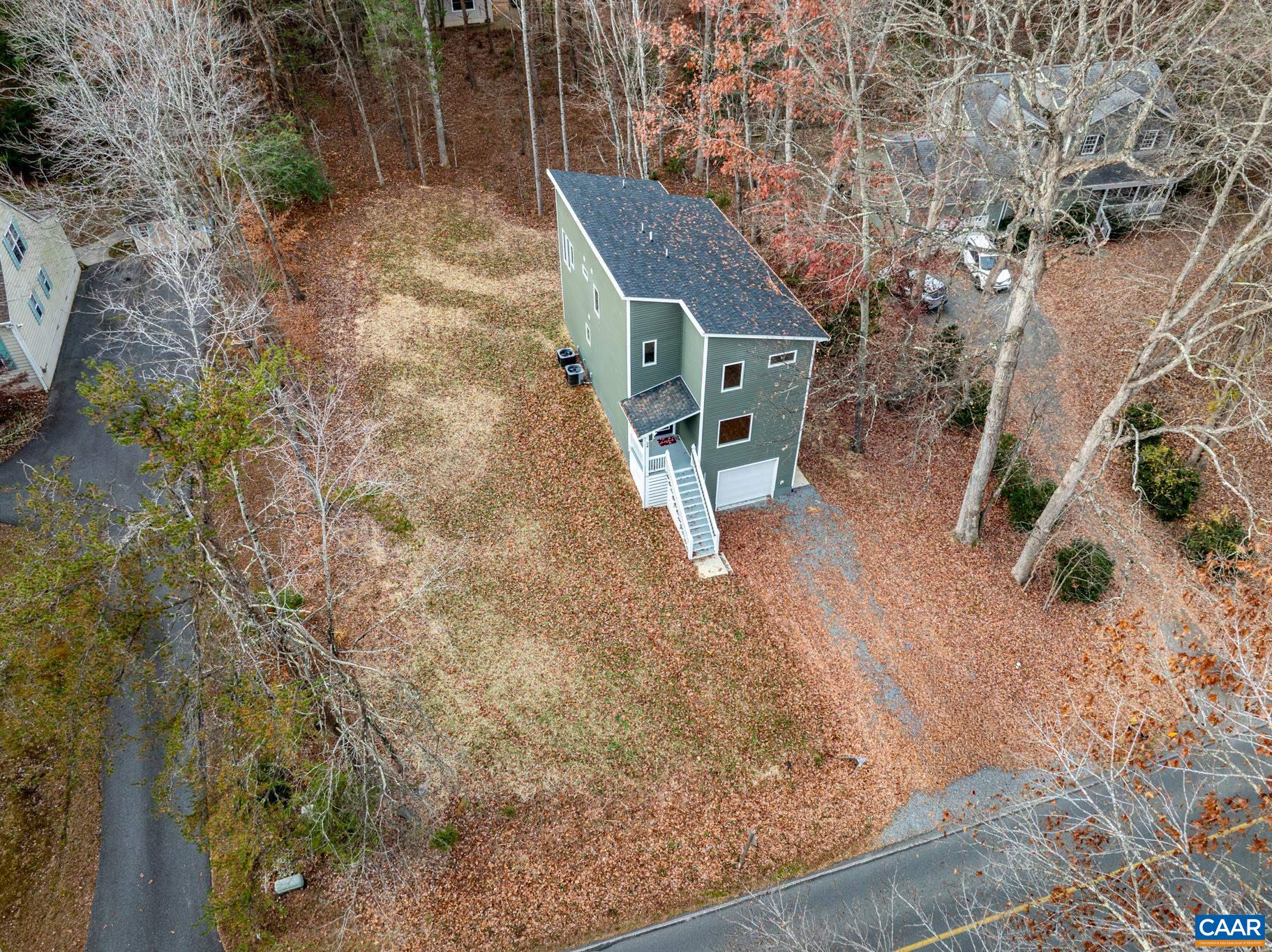 34 Turkeysag Trail Palmyra, VA 22963 - Photo 46 of 53 a backyard of a house with table and chairs