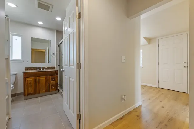 a view of walk in closet with living room