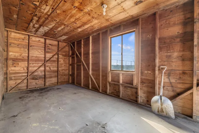 a view of an empty room with a balcony
