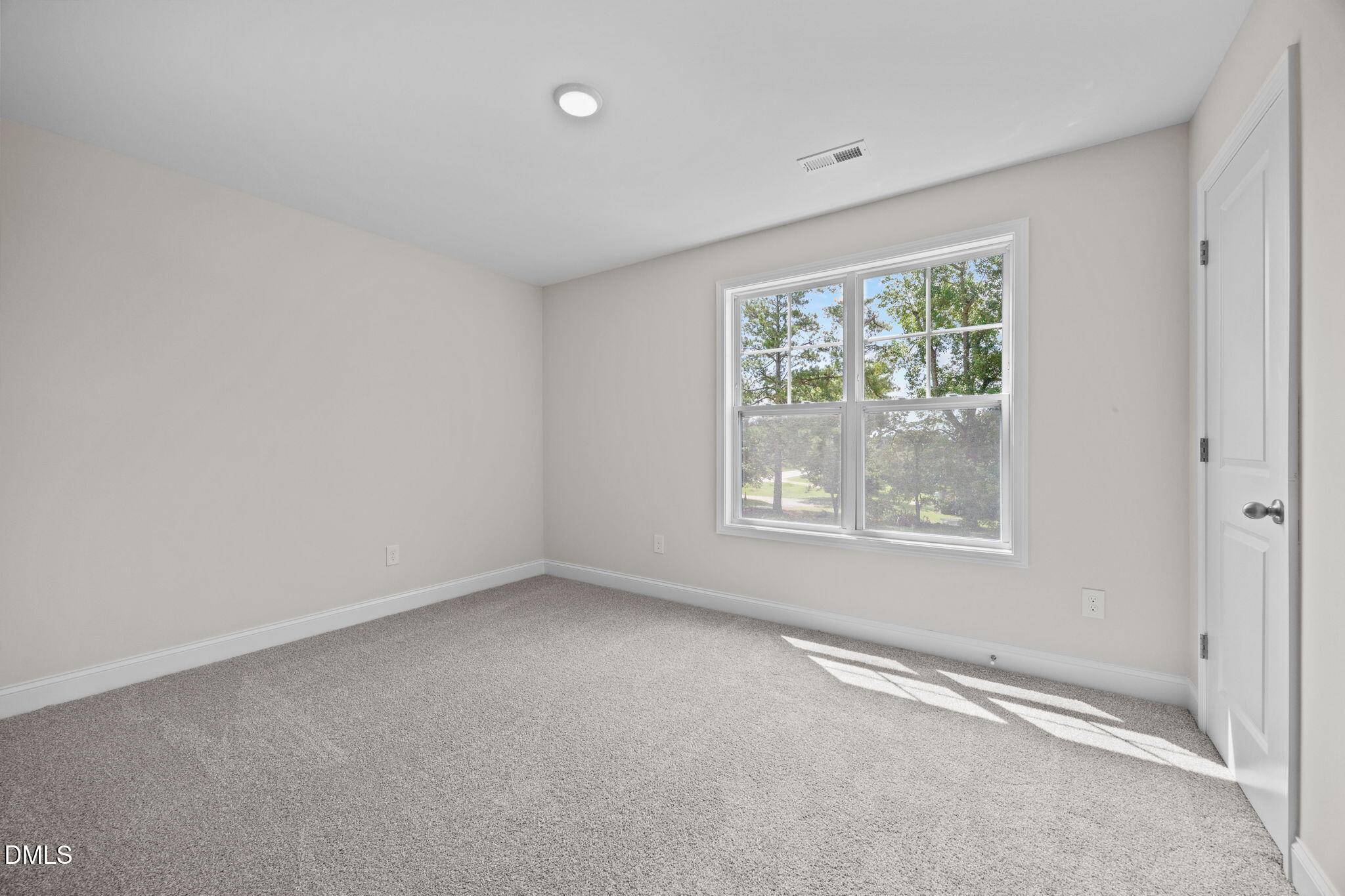 205 Regis Lane, Unit 11 Coats, NC 27521 - Photo 17 of 37 an empty room with a window