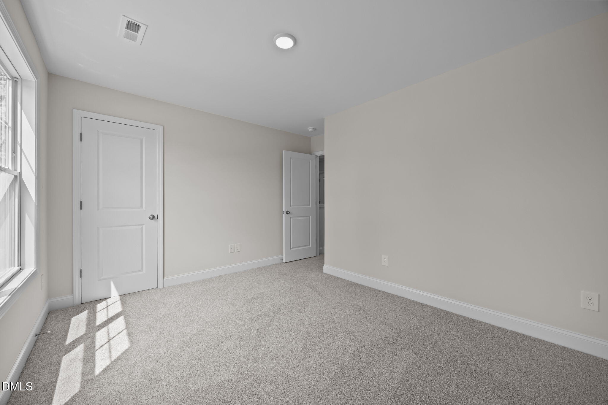 205 Regis Lane, Unit 11 Coats, NC 27521 - Photo 18 of 37 an empty room with windows