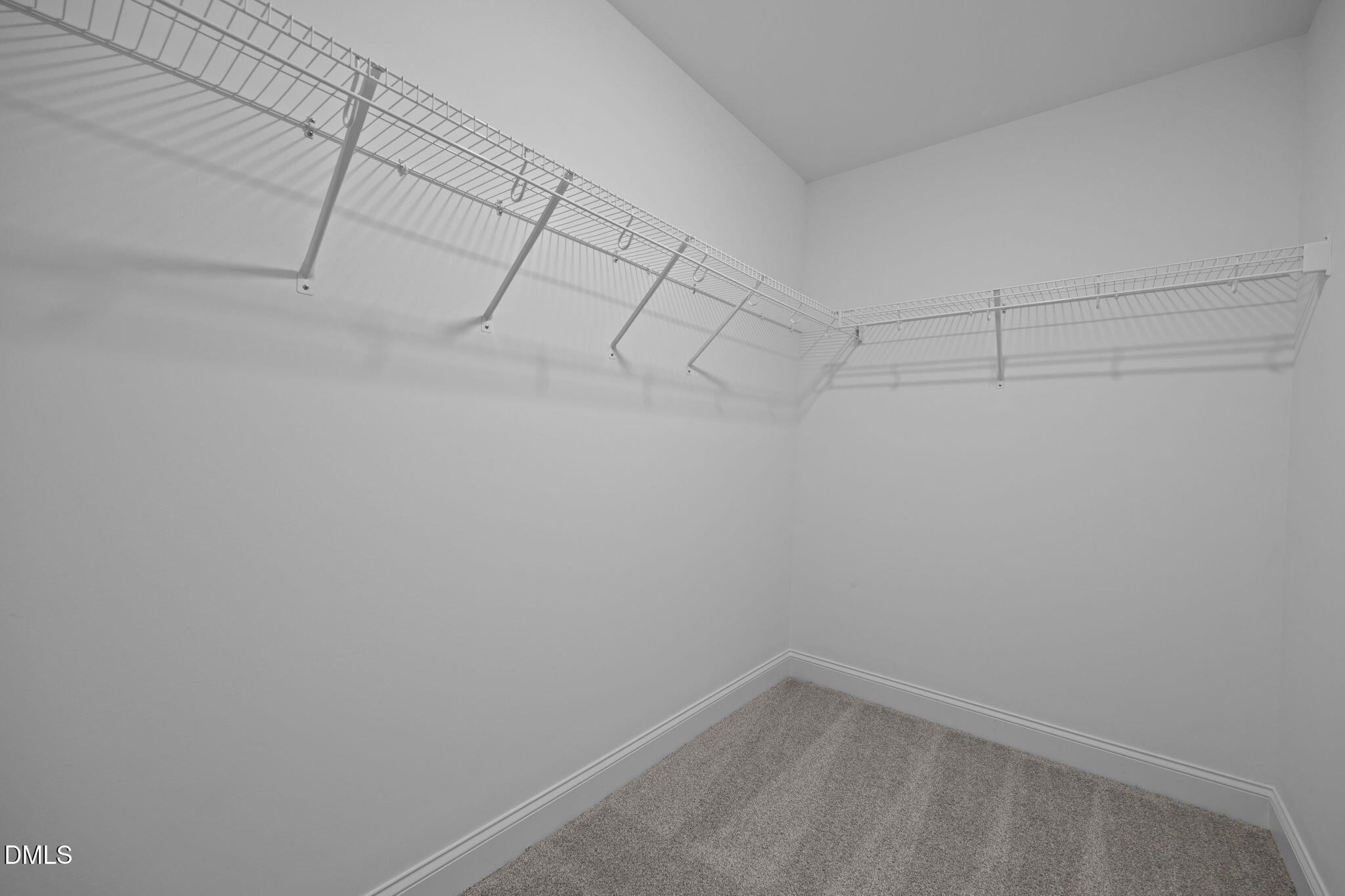 205 Regis Lane, Unit 11 Coats, NC 27521 - Photo 24 of 37 a view of a room with racks on the wall