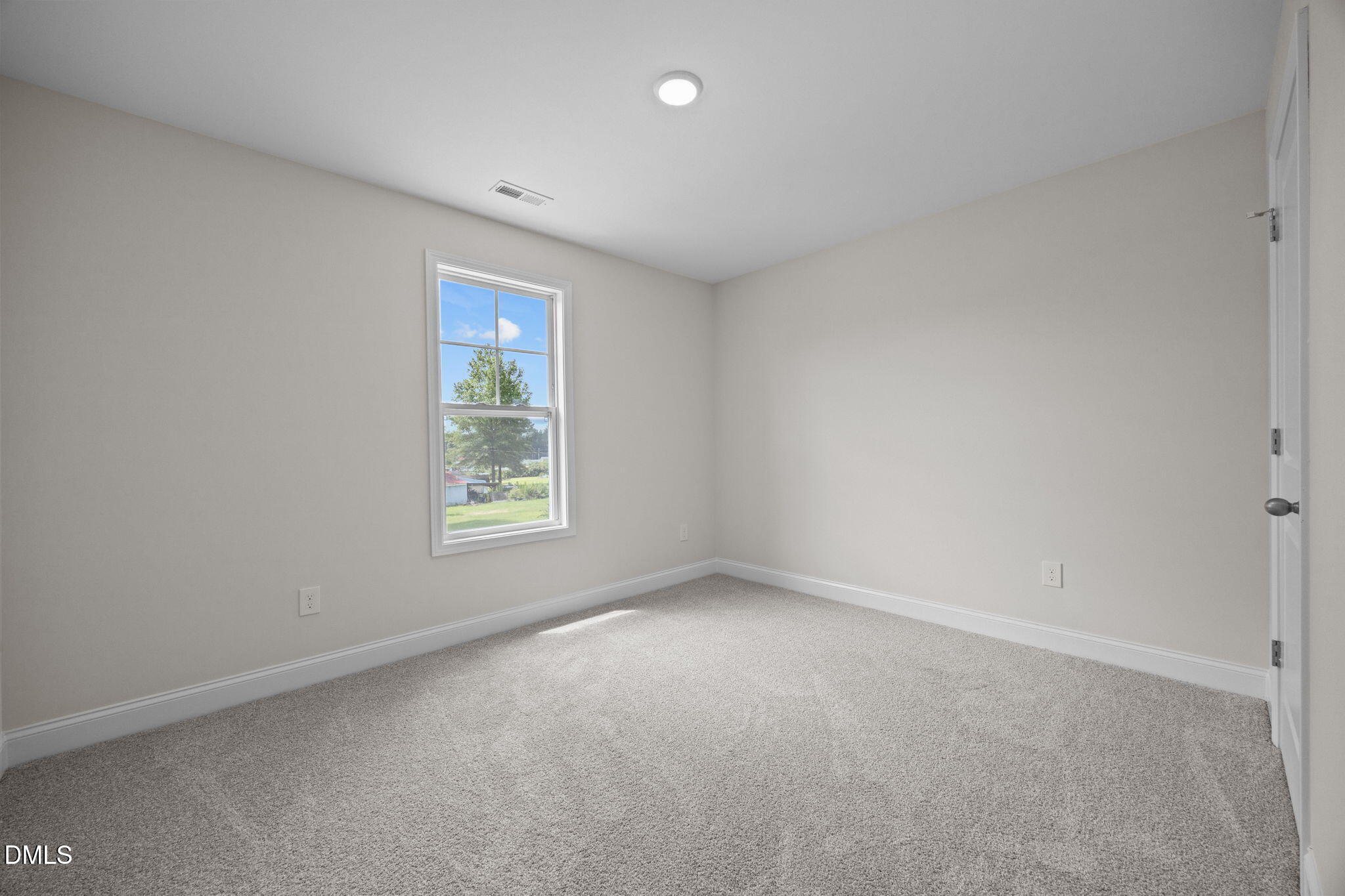 205 Regis Lane, Unit 11 Coats, NC 27521 - Photo 26 of 37 a view of an empty room with a window