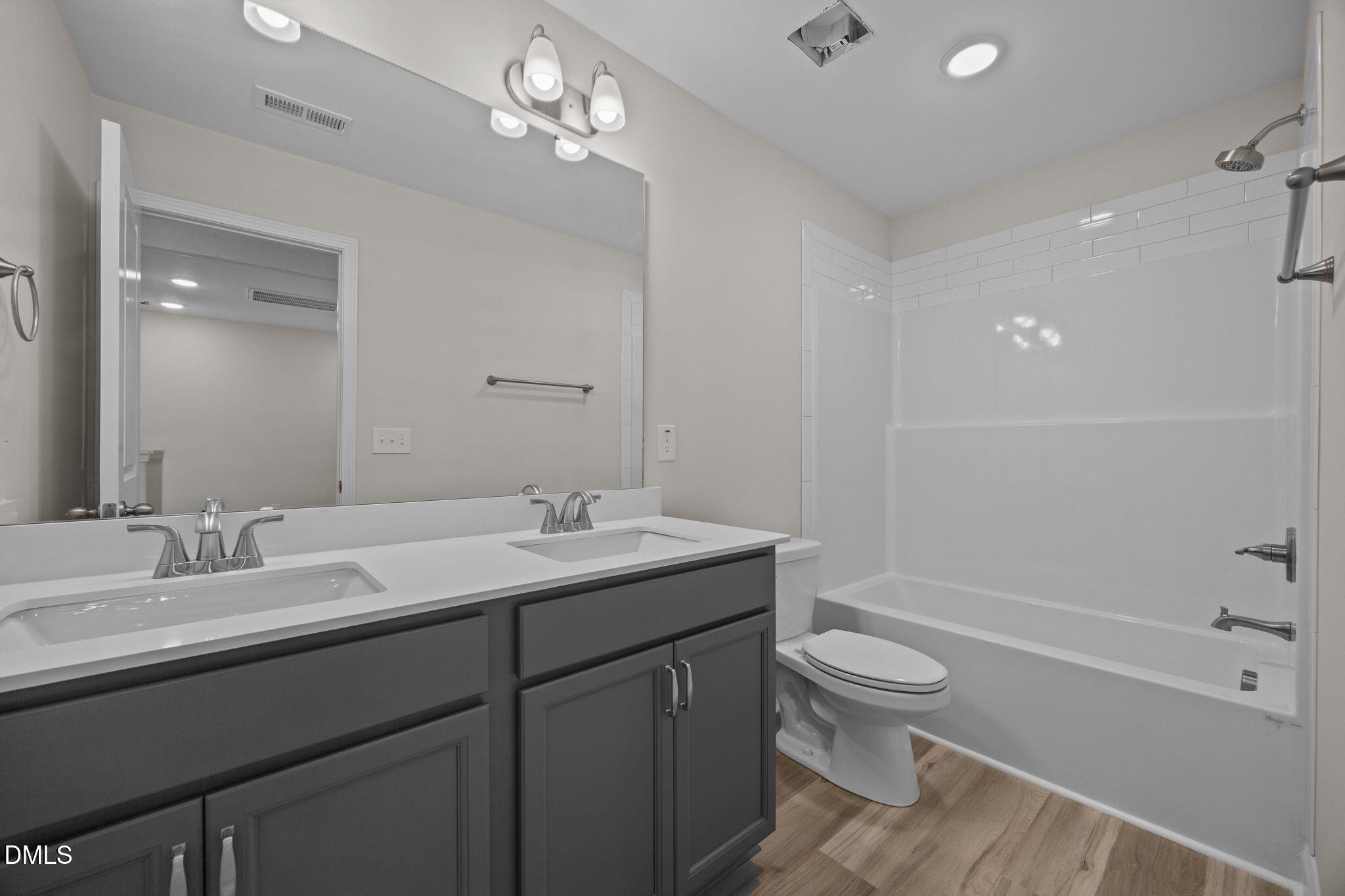 205 Regis Lane, Unit 11 Coats, NC 27521 - Photo 28 of 37 a bathroom with a sink a toilet and shower