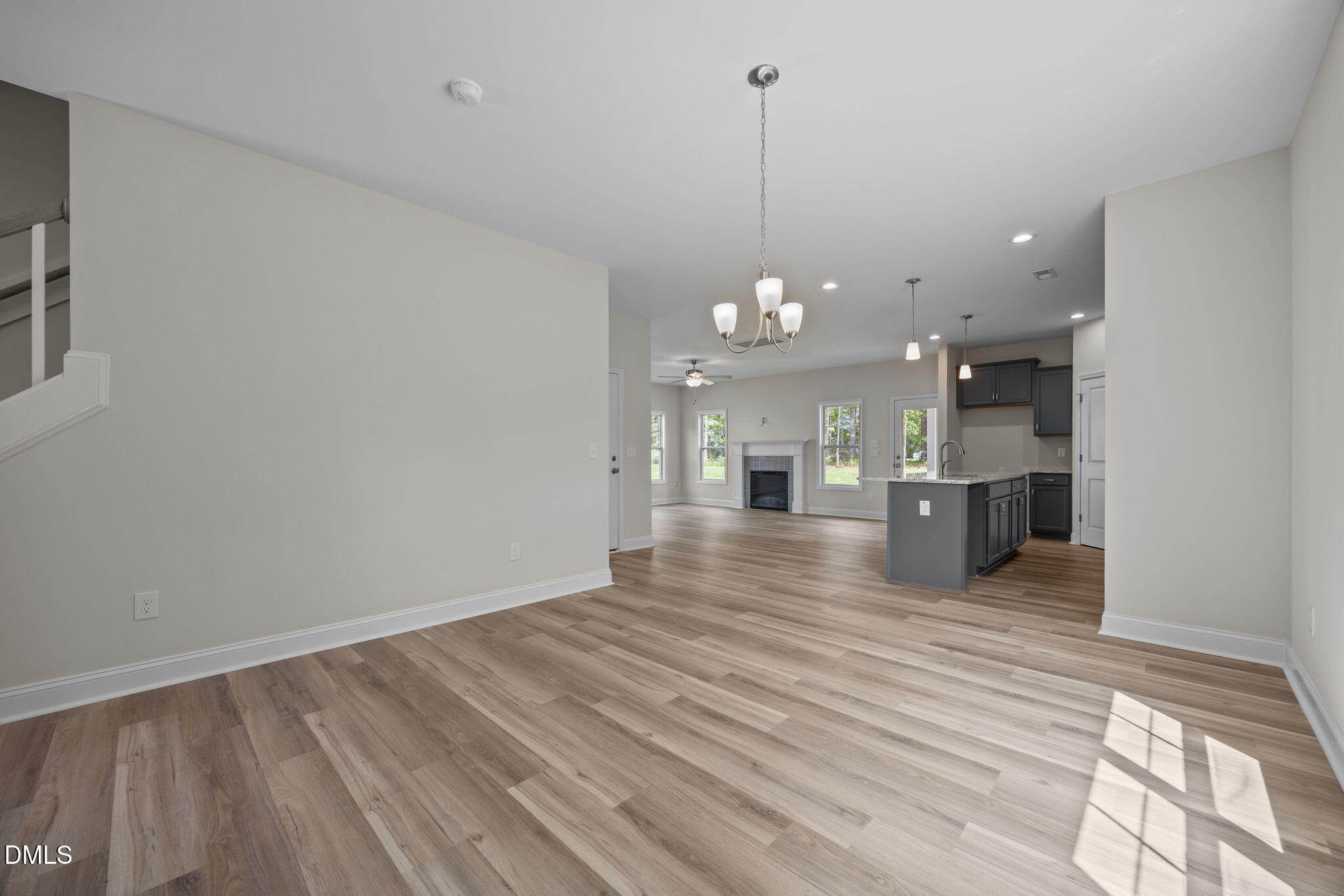 205 Regis Lane, Unit 11 Coats, NC 27521 - Photo 6 of 37 a view of an empty room and kitchen view