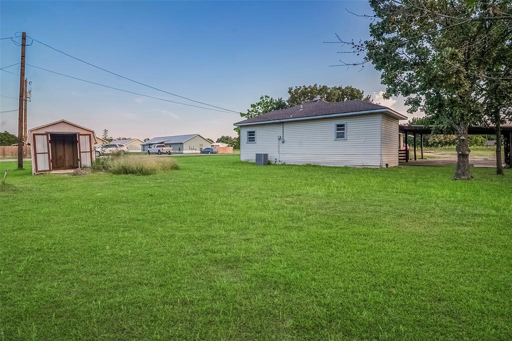 306 North Front Street Savoy, TX 75479 - Photo 19 of 19 a view of a house with a yard