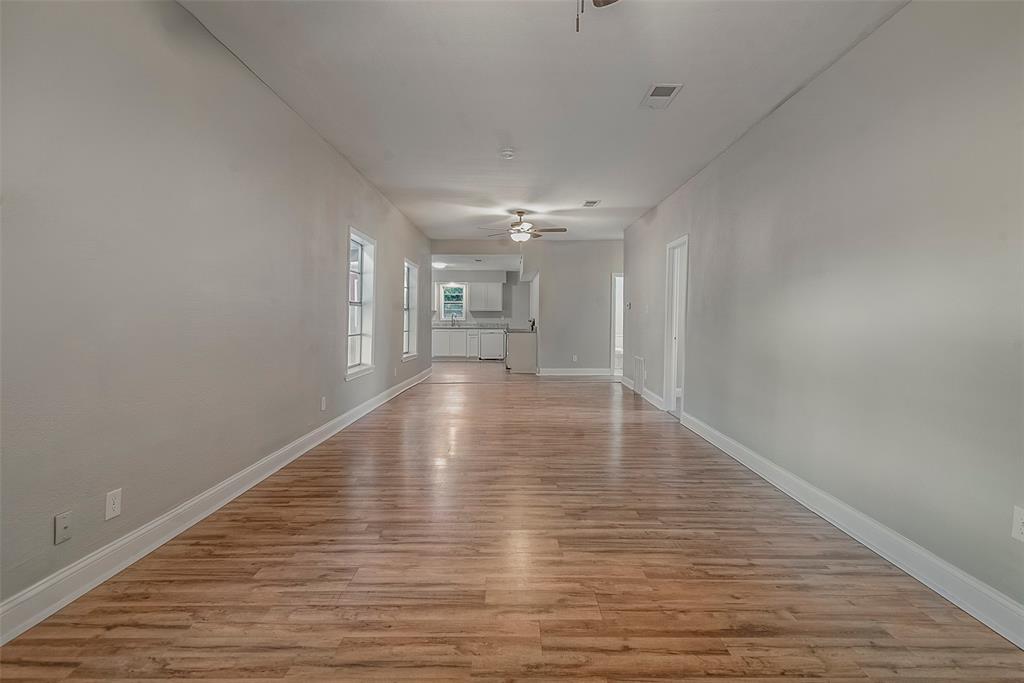 306 North Front Street Savoy, TX 75479 - Photo 3 of 19 a view of empty room with wooden floor