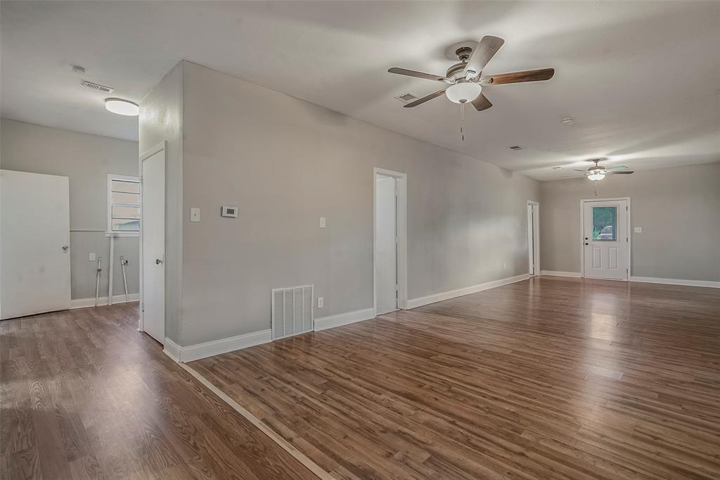 306 North Front Street Savoy, TX 75479 - Photo 6 of 19 a view of an empty room with wooden floor