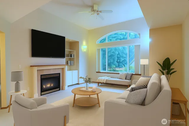 a living room with furniture a fireplace and a flat screen tv