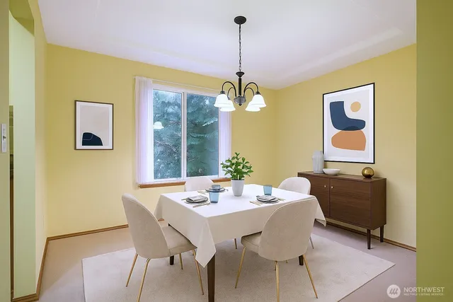 a view of a dining room with furniture and windows