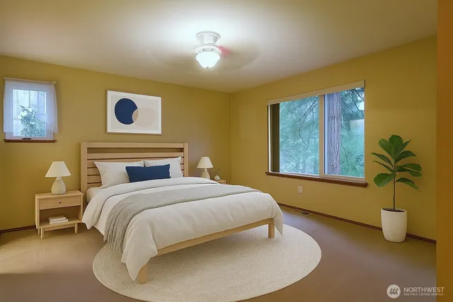 a bedroom with a bed and window