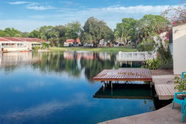 a view of a lake with houses with outdoor space