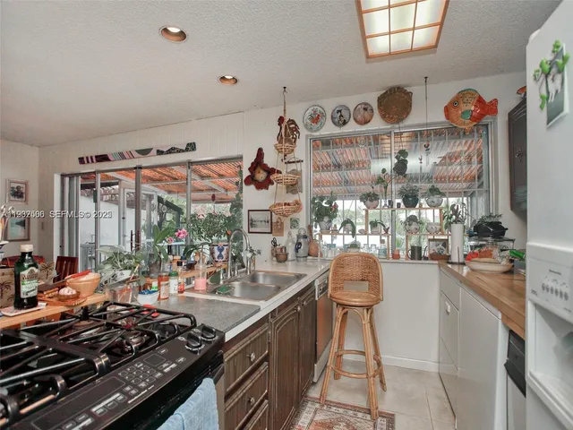 a kitchen with a stove and a table